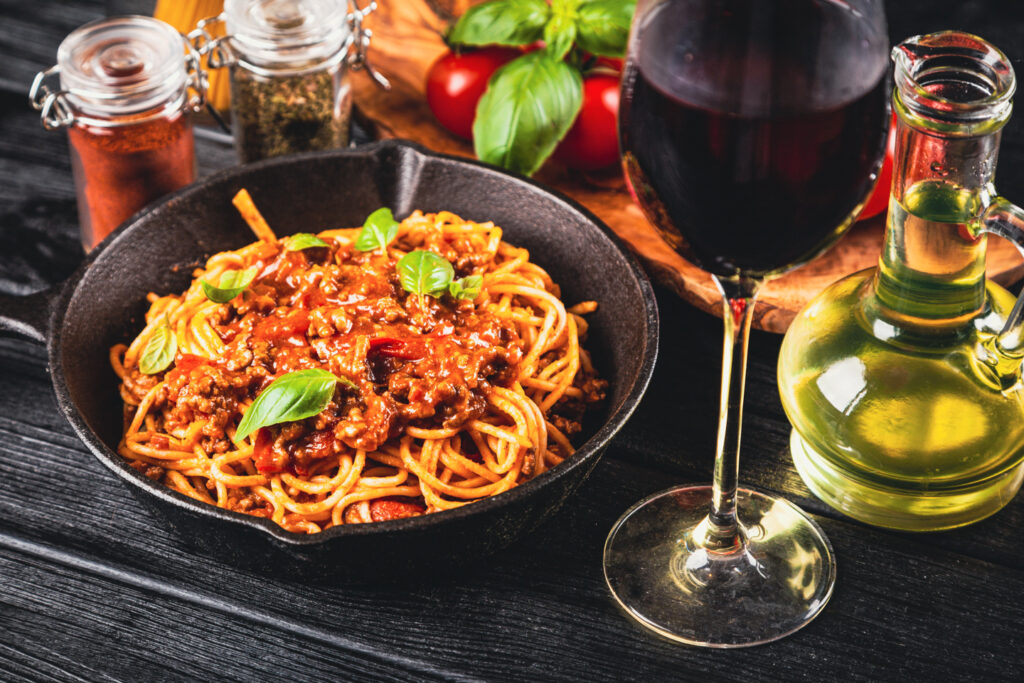 spagetti bolognese and red wine glass