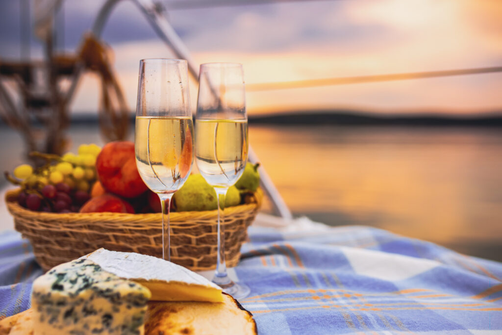 picnic by lake with prosecco