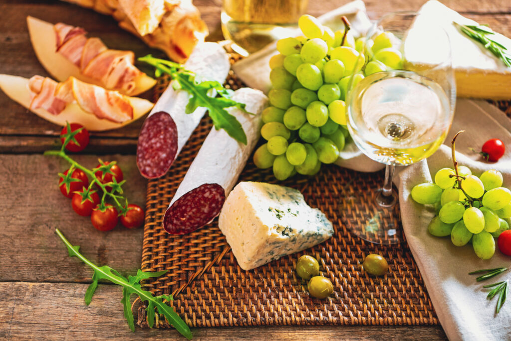 grapes, salami, blue cheese, olives and white wine
